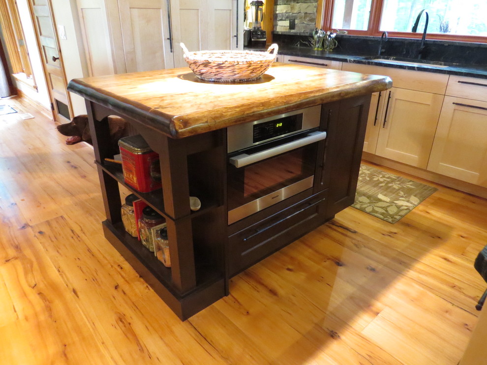 Example of a large mountain style u-shaped light wood floor eat-in kitchen design in Toronto with shaker cabinets, granite countertops, stone tile backsplash, an island, an undermount sink, light wood cabinets, gray backsplash and stainless steel appliances
