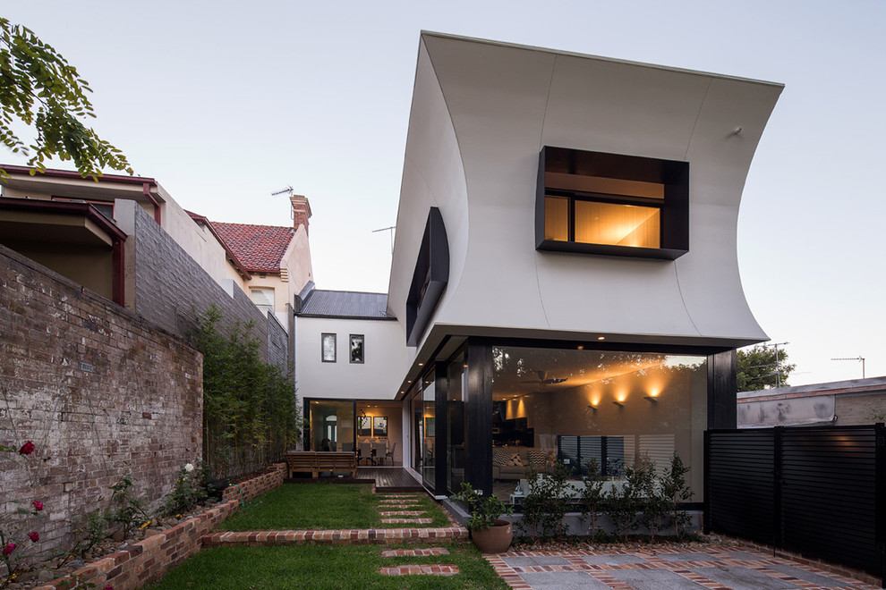 Inspiration for a large contemporary two-storey concrete white exterior in Sydney with a flat roof.
