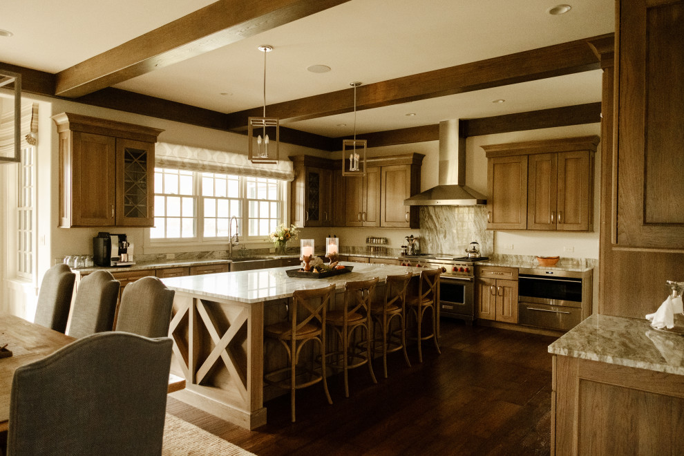 Large mountain style u-shaped exposed beam open concept kitchen photo in Chicago with paneled appliances and an island