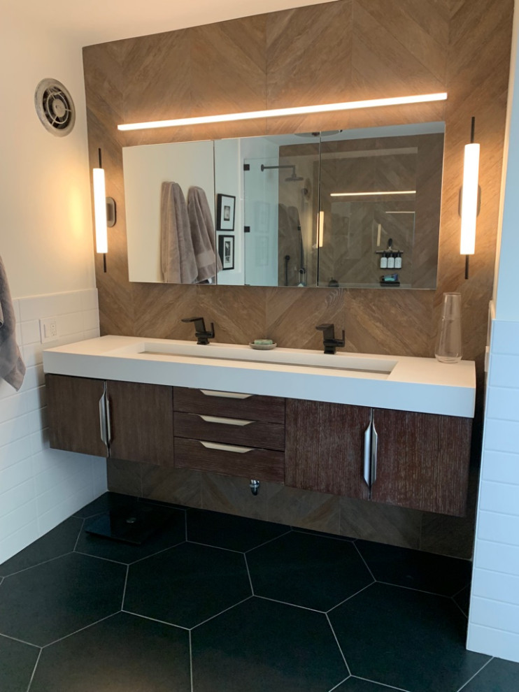 Inspiration for a small 1950s brown tile and ceramic tile ceramic tile, black floor and double-sink bathroom remodel in Chicago with flat-panel cabinets, dark wood cabinets, a two-piece toilet, white walls, a vessel sink, quartz countertops, white countertops and a floating vanity