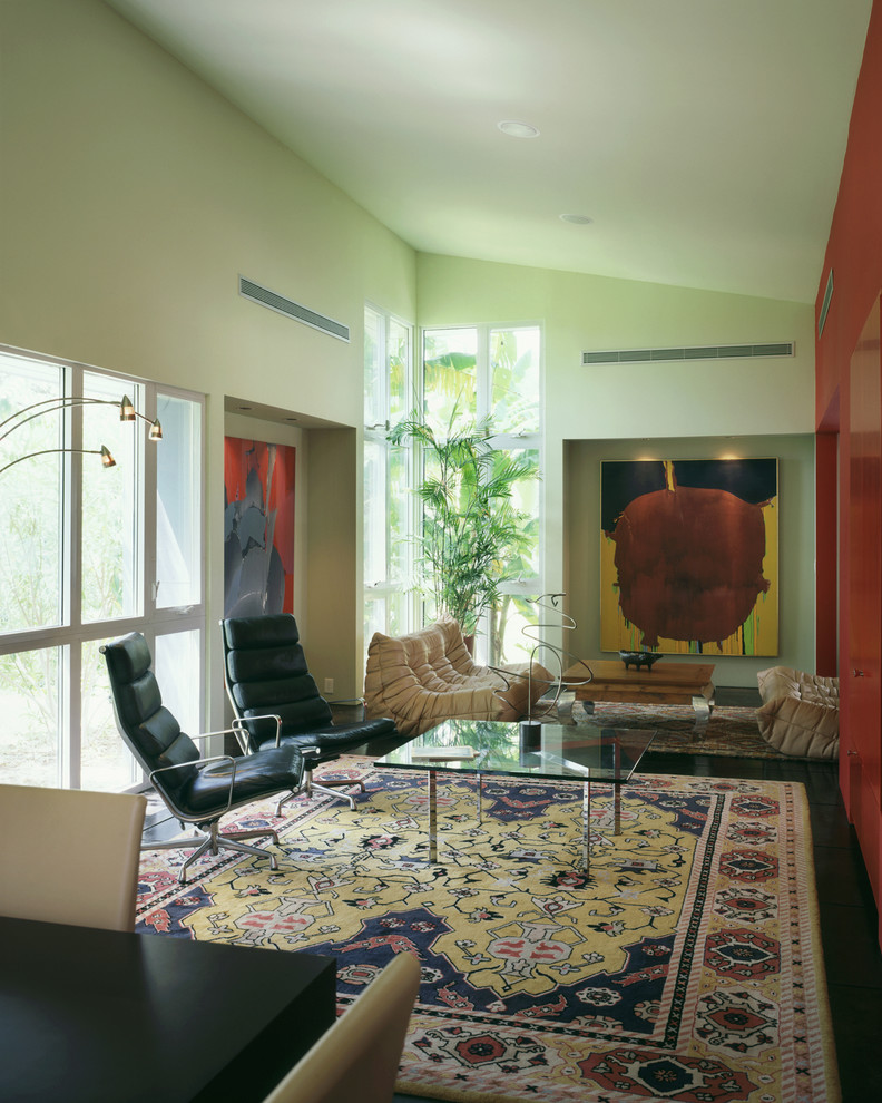 Photo of a contemporary living room in Austin with green walls.