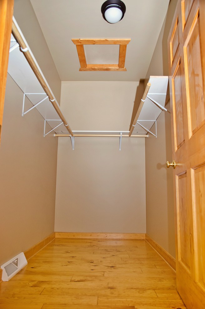 Inspiration for a large rustic gender-neutral light wood floor and brown floor home design remodel