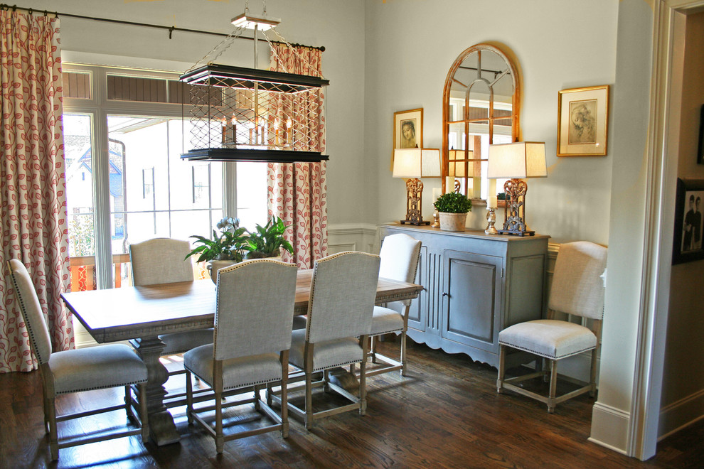 Photo of a transitional dining room in Atlanta with medium hardwood floors.