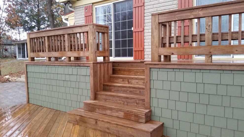 Huge arts and crafts backyard deck photo in Indianapolis
