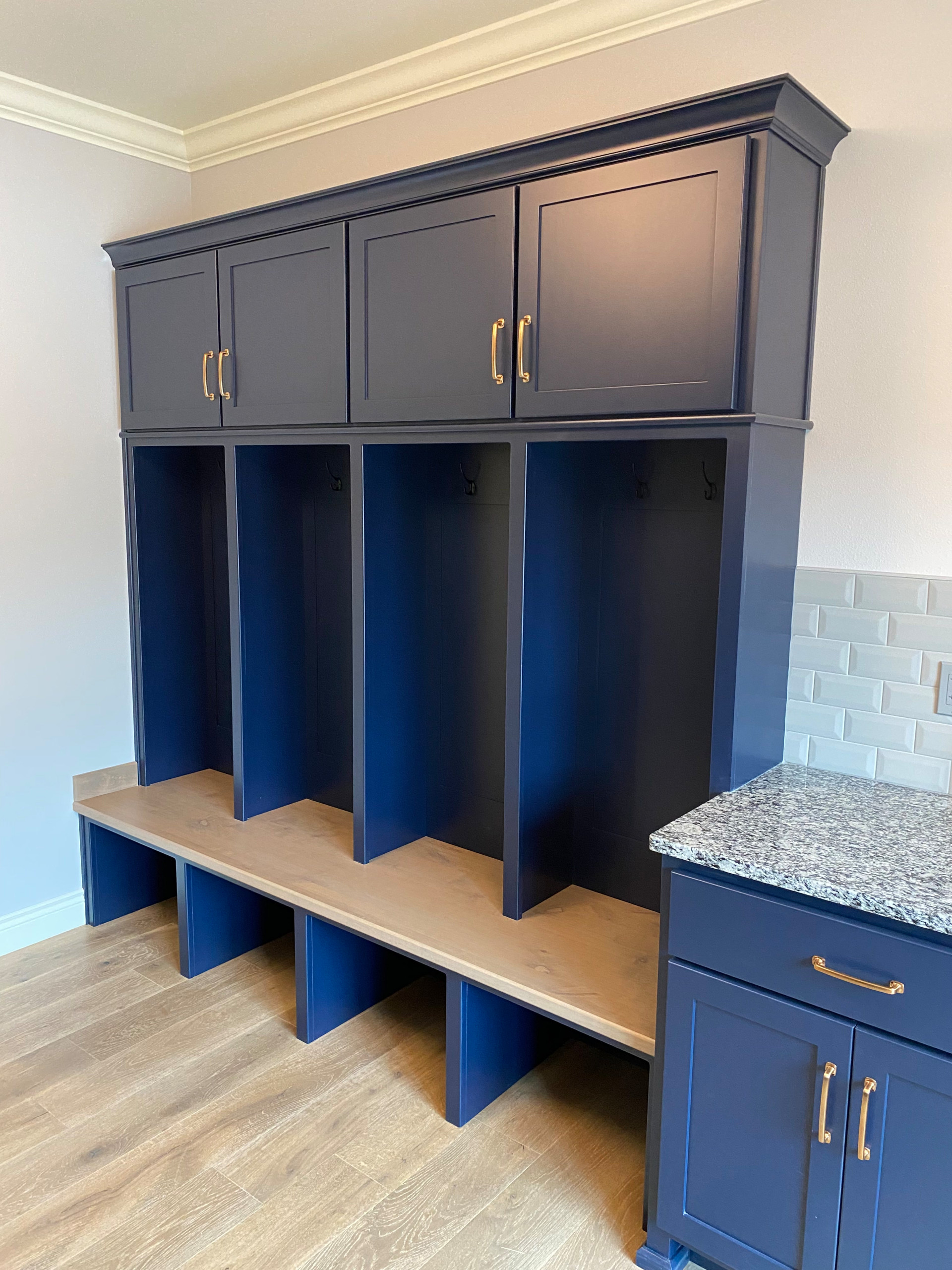 Custom painted mudroom bench and cabinetry