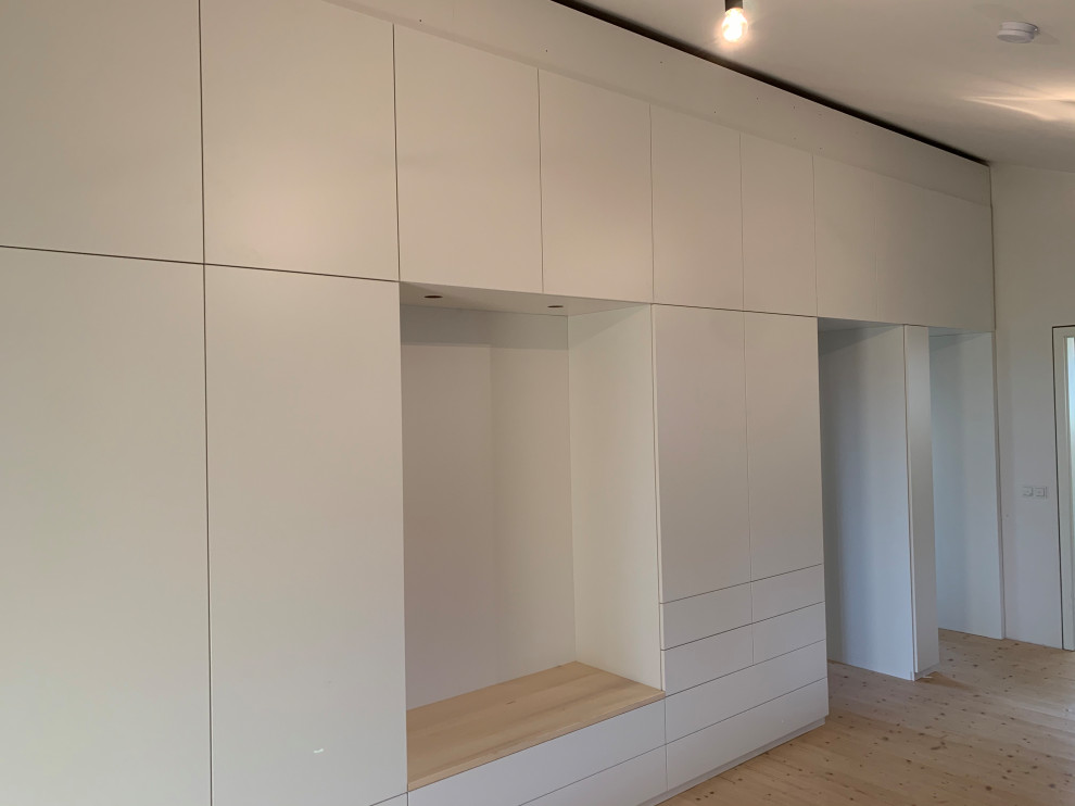 Photo of a contemporary storage and wardrobe in Munich.