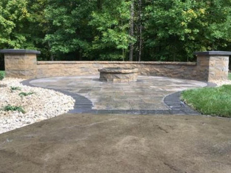Transitional stamped concrete patio photo in Minneapolis with a fire pit and no cover