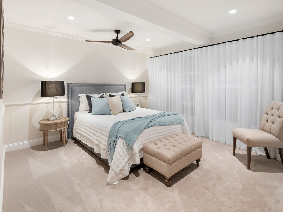 This is an example of a beach style bedroom in Brisbane.