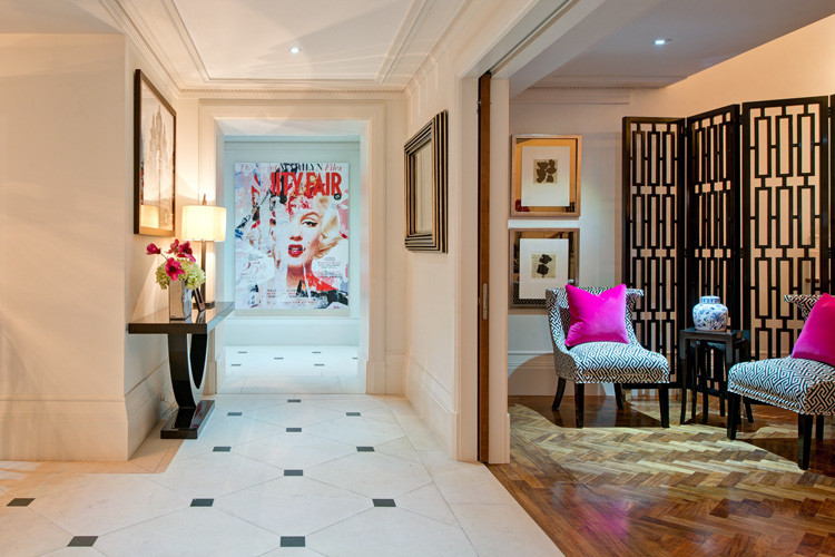 Photo of a large contemporary entry hall in London with terra-cotta floors and multi-coloured floor.