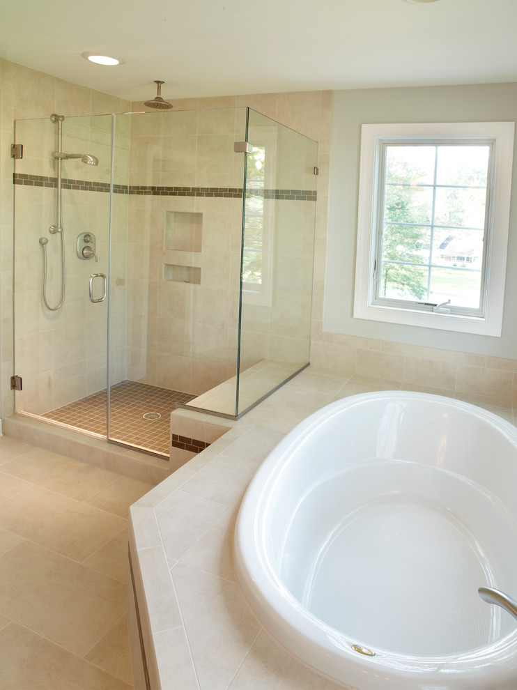 Large transitional bathroom in Philadelphia with a drop-in tub, a corner shower, beige tile, ceramic tile and ceramic floors.