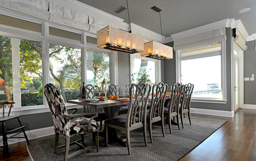 Photo of an eclectic dining room in Miami with grey walls and dark hardwood floors.