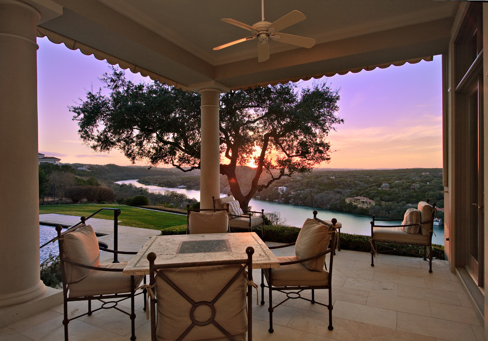 Traditional patio in Austin with a roof extension.