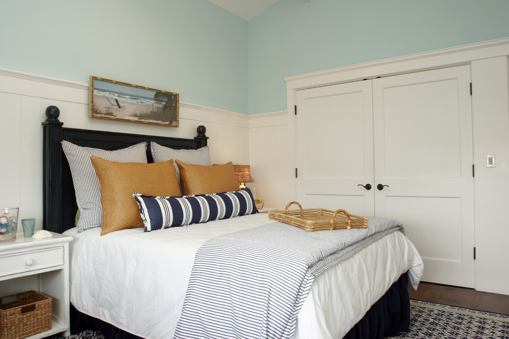This is an example of a beach style bedroom in Los Angeles with blue walls.