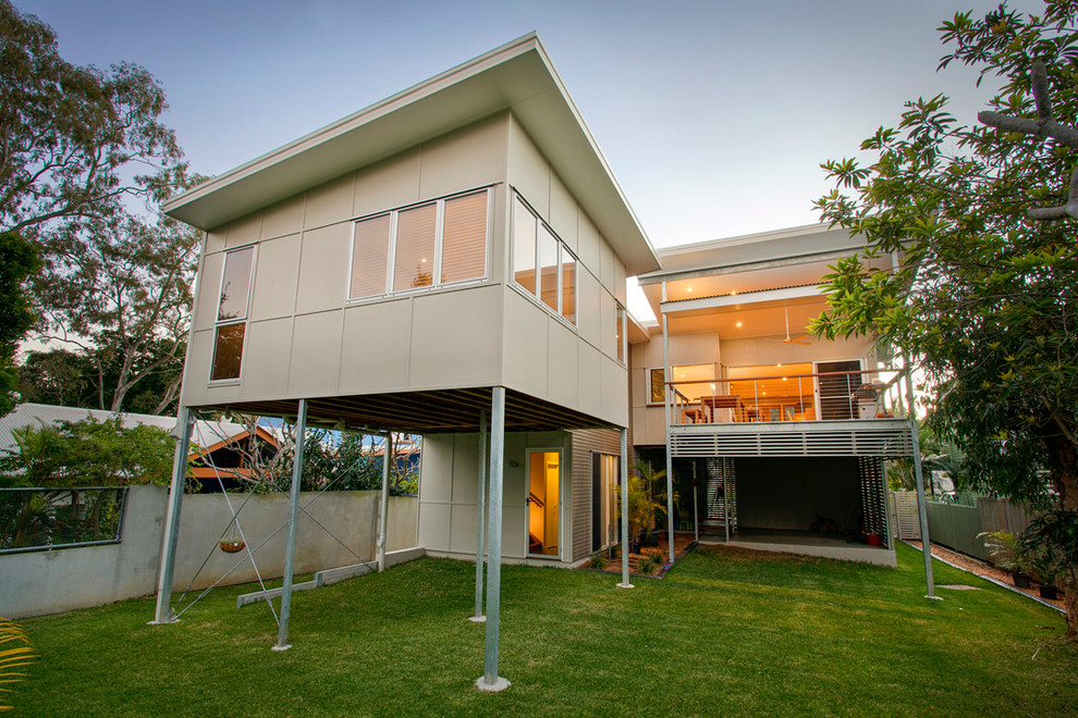 Large transitional two-storey multi-coloured house exterior in Brisbane with a metal roof.