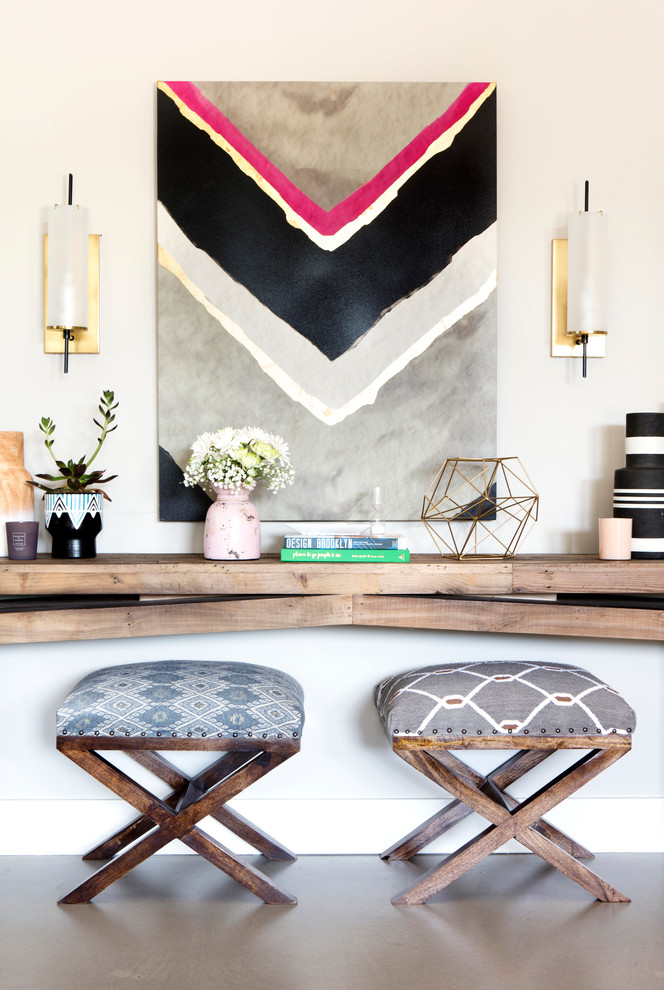 Inspiration for a mid-sized transitional concrete floor foyer remodel in Austin with gray walls