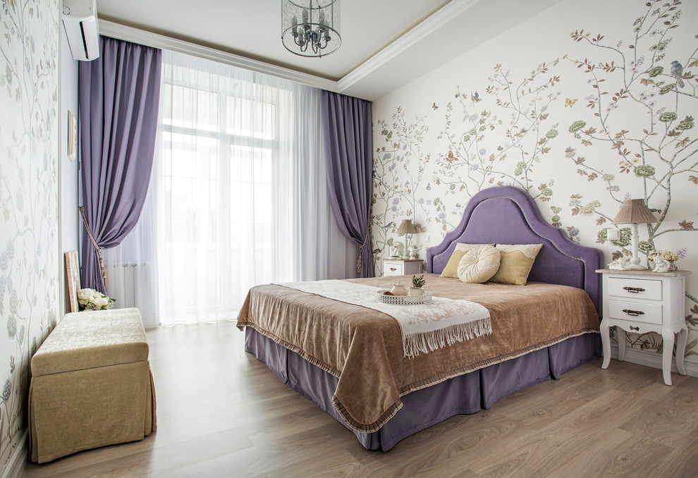 Small traditional master bedroom in Other with multi-coloured walls, light hardwood floors and beige floor.