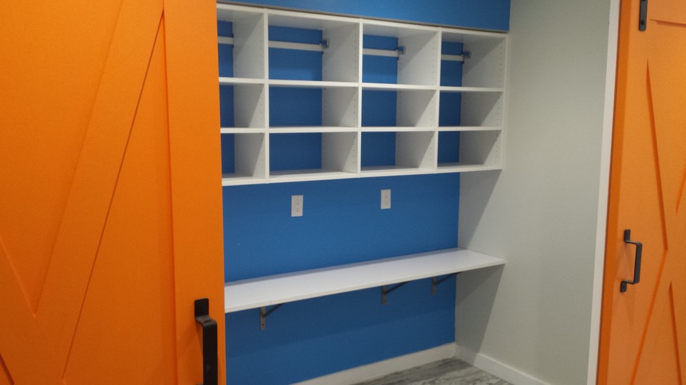 This is an example of a transitional storage and wardrobe in New York.