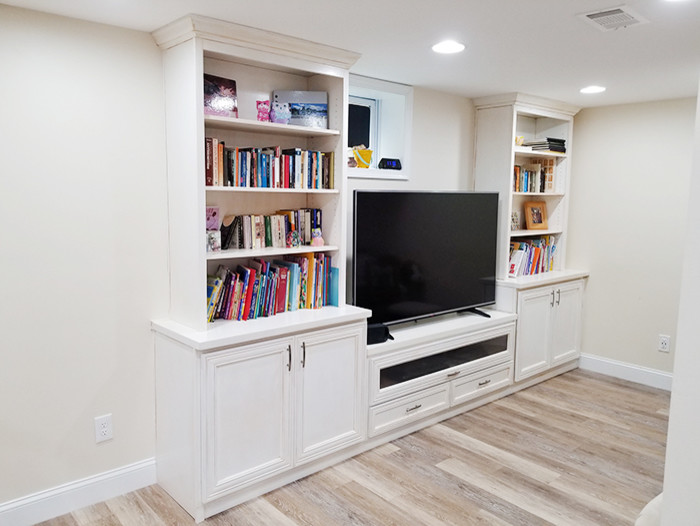 Inspiration for a mid-sized transitional walk-out basement in DC Metro with white walls, vinyl floors, no fireplace and multi-coloured floor.