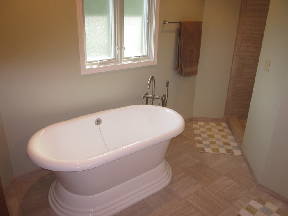 Mid-sized transitional master ceramic tile freestanding bathtub photo with beige walls
