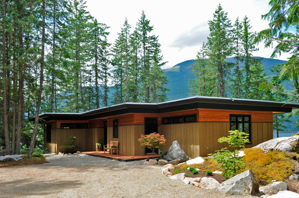 Mid-sized contemporary one-storey exterior in Vancouver with wood siding.