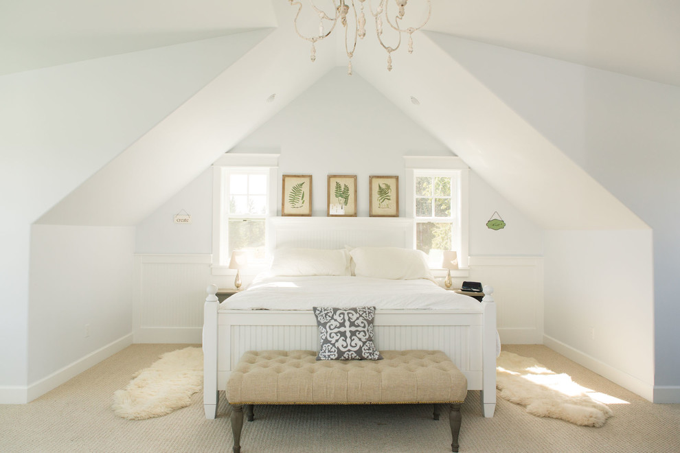 Photo of a mid-sized country master bedroom in Portland with white walls, carpet and beige floor.