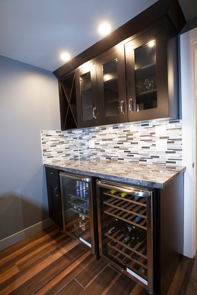 Small contemporary galley wet bar in Vancouver with shaker cabinets, dark wood cabinets and quartz benchtops.