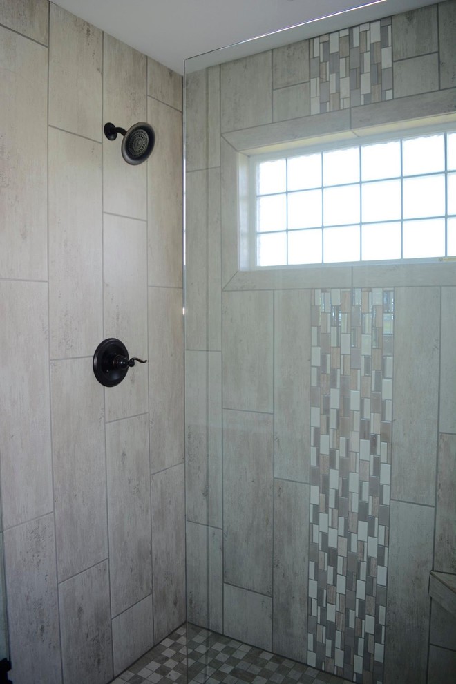 Drop-in bathtub - large transitional master beige tile and ceramic tile ceramic tile drop-in bathtub idea with beige walls and granite countertops