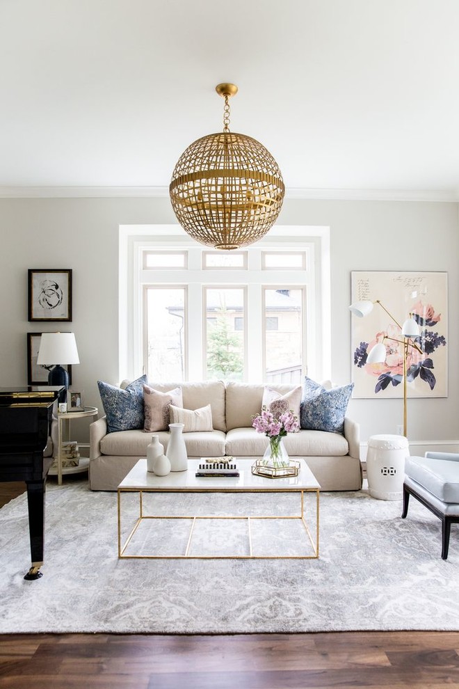 Inspiration for a transitional living room in Sydney with beige walls, medium hardwood floors and brown floor.