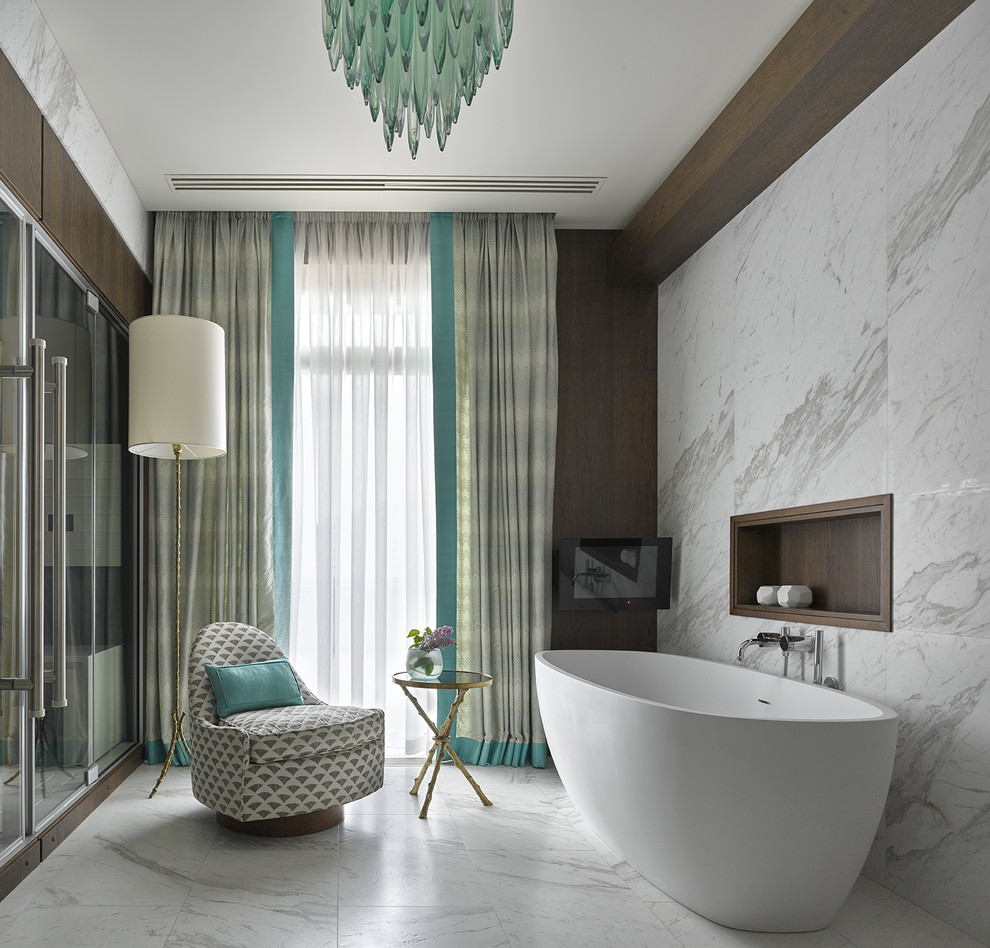 This is an example of a transitional master bathroom in Saint Petersburg with a freestanding tub, white tile, marble, marble floors and white floor.