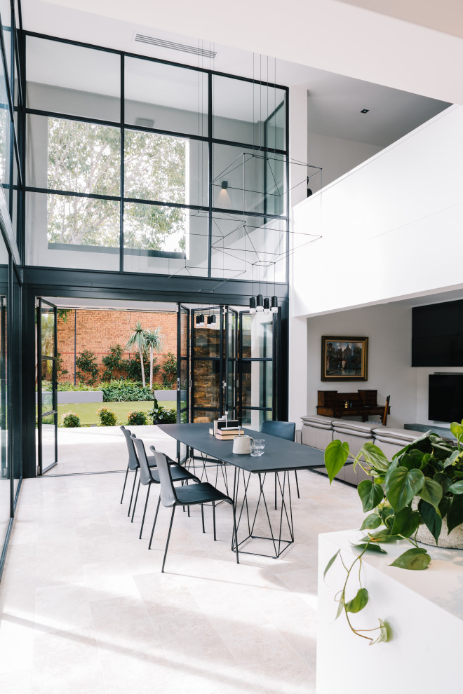 Inspiration for a contemporary open plan dining in Adelaide with white walls and grey floor.