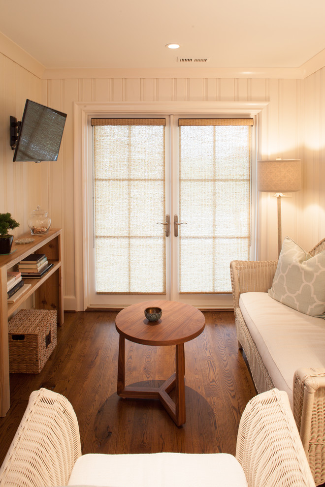 Photo of a mid-sized beach style guest bedroom in Raleigh with beige walls, dark hardwood floors and no fireplace.