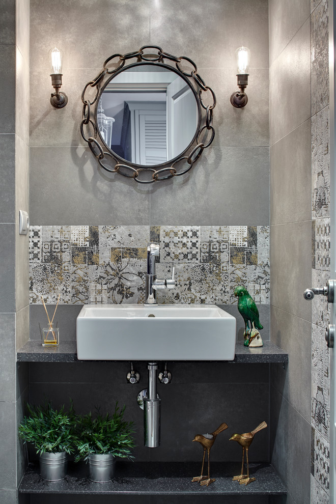 Design ideas for a transitional powder room in Moscow with gray tile and a vessel sink.