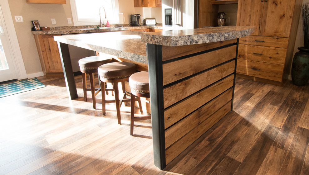 Eat-in kitchen - mid-sized rustic l-shaped medium tone wood floor and brown floor eat-in kitchen idea in Denver with an undermount sink, shaker cabinets, medium tone wood cabinets, quartz countertops, black appliances, an island and multicolored countertops