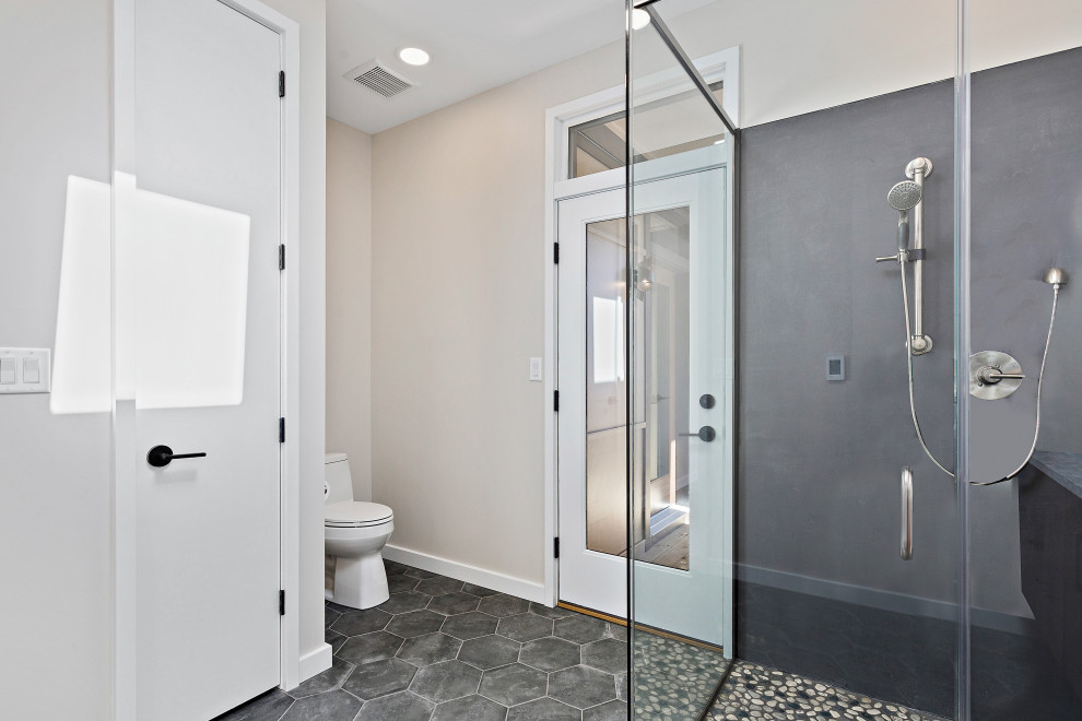 Inspiration for a large modern ensuite bathroom in DC Metro with flat-panel cabinets, medium wood cabinets, a corner shower, engineered stone worktops, a hinged door, a wall niche, double sinks and a floating vanity unit.