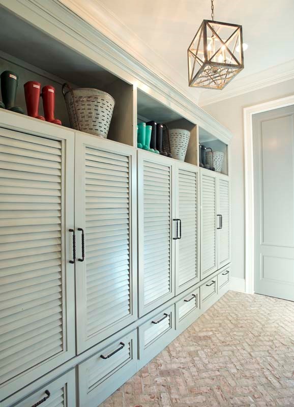Photo of a traditional mudroom in Nashville with brick floors.