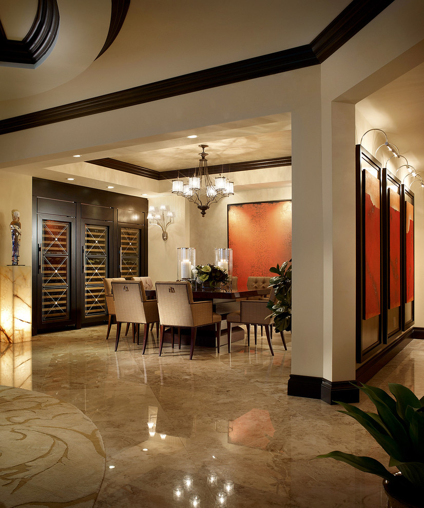 Design ideas for a contemporary dining room in Miami with beige walls and marble floors.