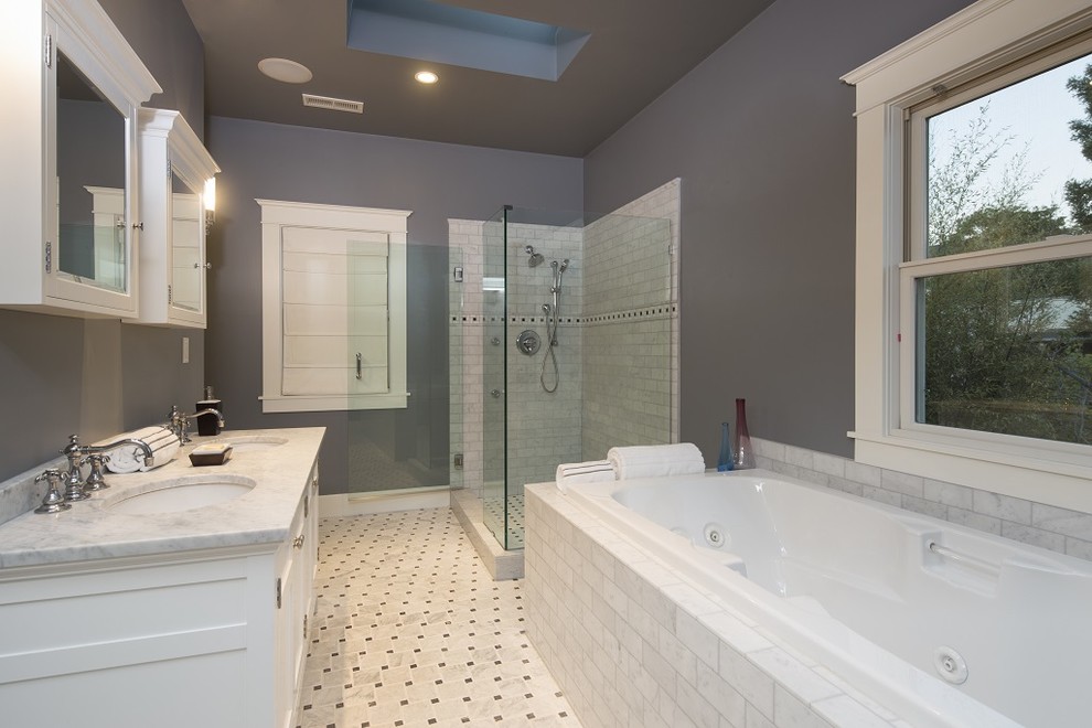 Photo of a large master bathroom in Los Angeles with an undermount sink, white cabinets, marble benchtops, a drop-in tub, a corner shower, white tile, subway tile, grey walls and marble floors.