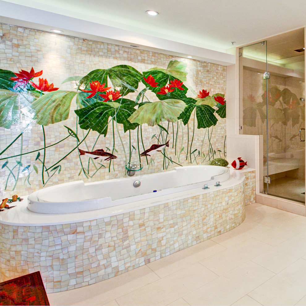 Inspiration for a contemporary bathroom in Los Angeles with a drop-in tub, multi-coloured tile and mosaic tile.
