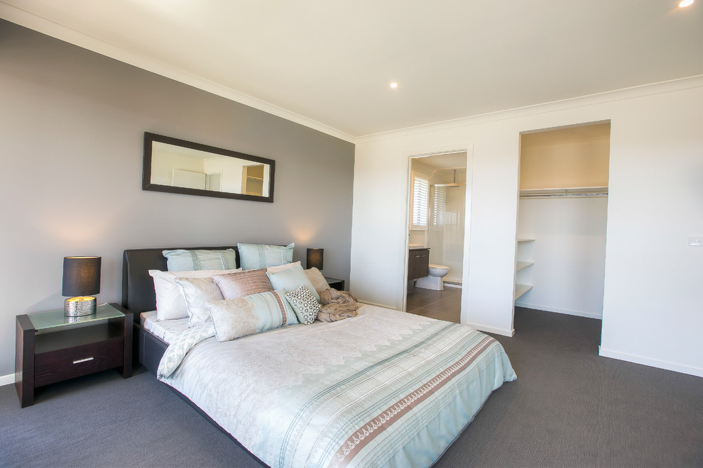 This is an example of a contemporary master bedroom in Melbourne.