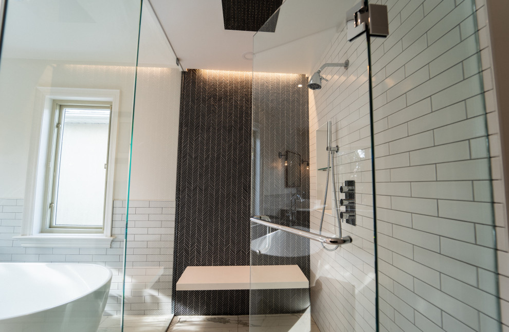 Large contemporary master bathroom in Toronto with a curbless shower, multi-coloured tile, subway tile, white walls, porcelain floors, multi-coloured floor and a hinged shower door.