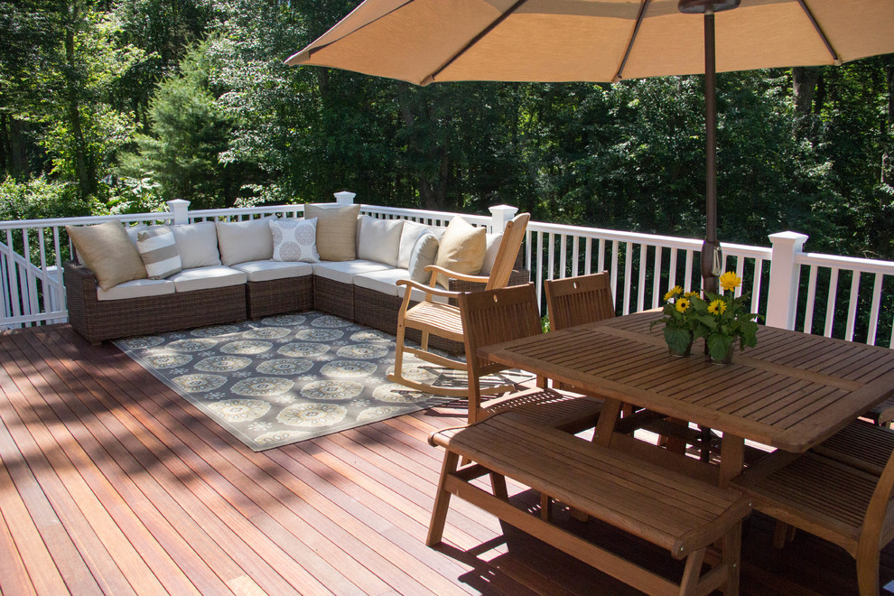 Inspiration for a mid-sized traditional backyard deck in Providence.