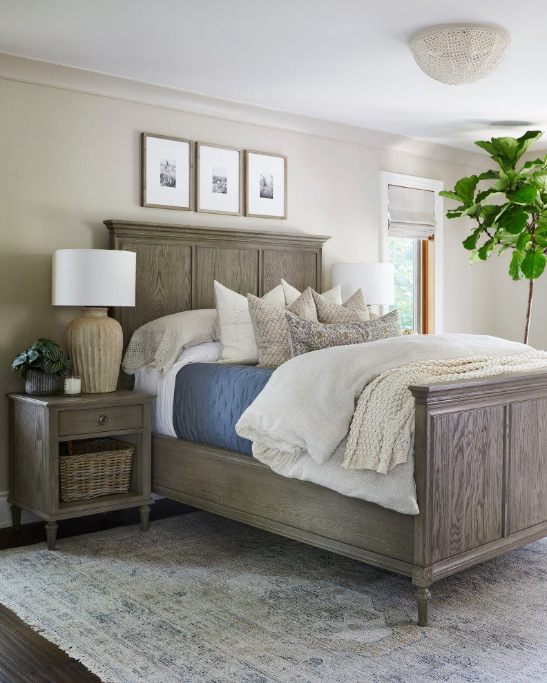Example of a mid-sized farmhouse master medium tone wood floor and brown floor bedroom design in Toronto with beige walls