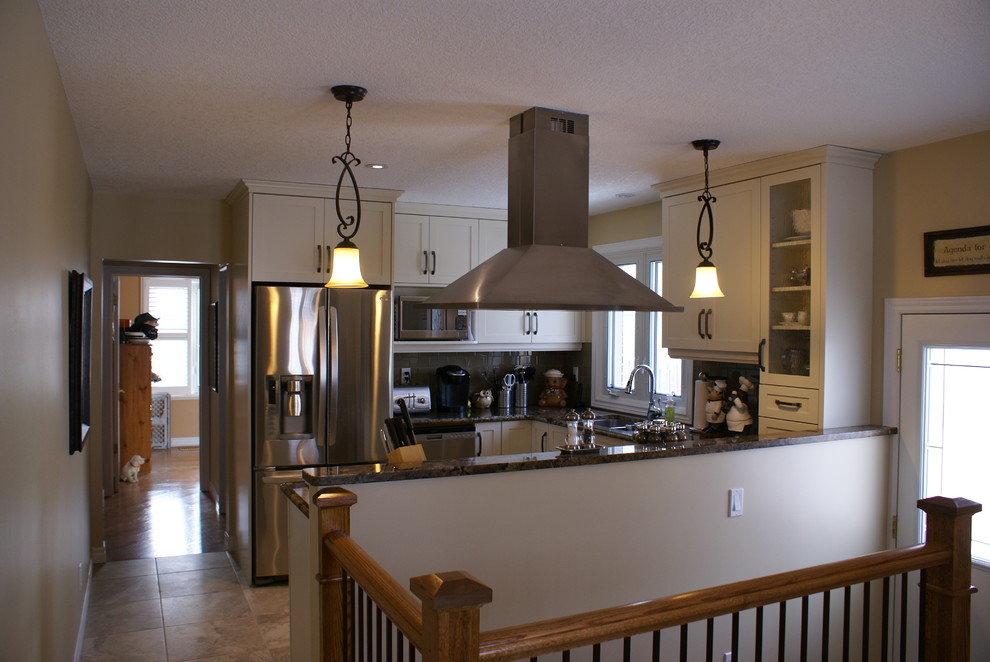 Inspiration for a small transitional eat-in kitchen remodel with recessed-panel cabinets, beige cabinets, granite countertops and stainless steel appliances