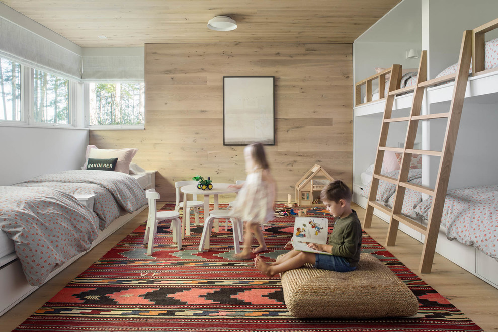 Photo of a contemporary kids' bedroom in Boston with brown walls, light hardwood floors and brown floor.