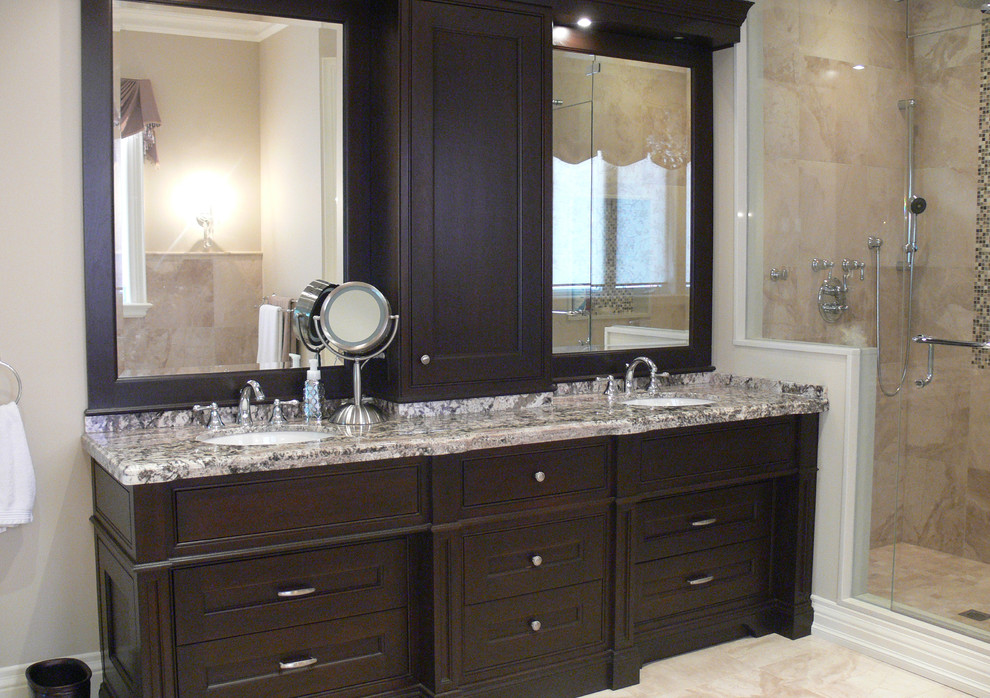 Large traditional master bathroom in Toronto with an undermount sink, beaded inset cabinets, dark wood cabinets, granite benchtops, a claw-foot tub, a one-piece toilet, beige tile, stone tile, beige walls and marble floors.