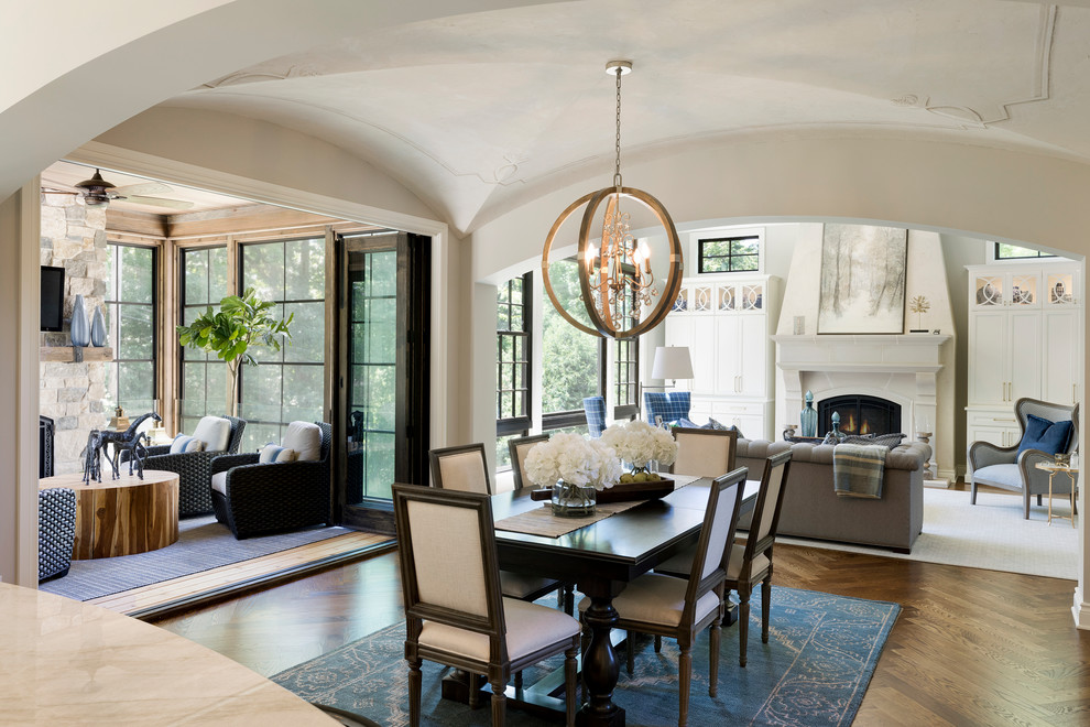Inspiration for a large traditional kitchen/dining combo in Minneapolis with medium hardwood floors and brown floor.