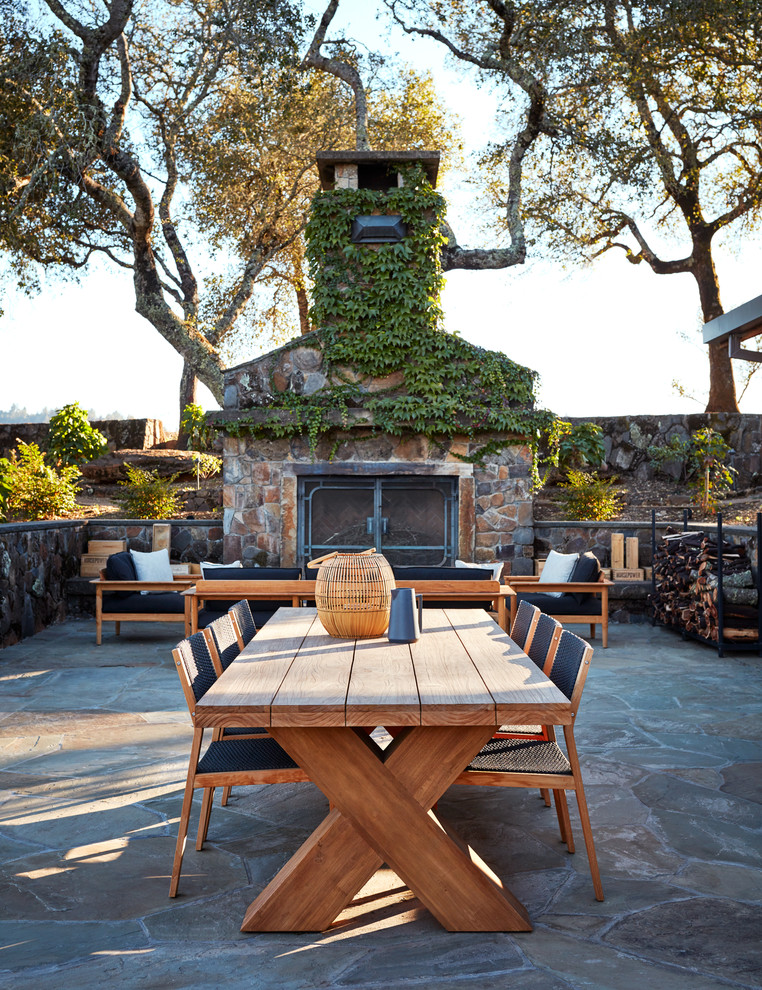Country patio in San Francisco with natural stone pavers and no cover.