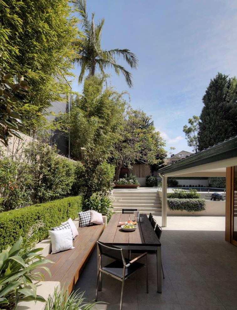 Design ideas for a contemporary backyard formal garden for summer in Sydney.