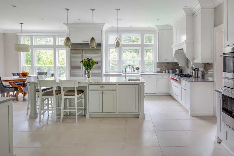 Inspiration for a huge transitional l-shaped ceramic tile and white floor kitchen remodel in Boston with a single-bowl sink, shaker cabinets, white cabinets, concrete countertops, stainless steel appliances and an island