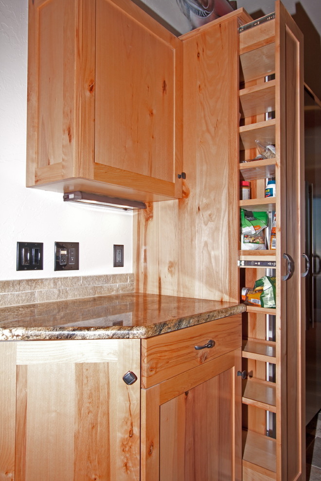 Photo of a large country u-shaped eat-in kitchen in Other with medium wood cabinets, with island and shaker cabinets.